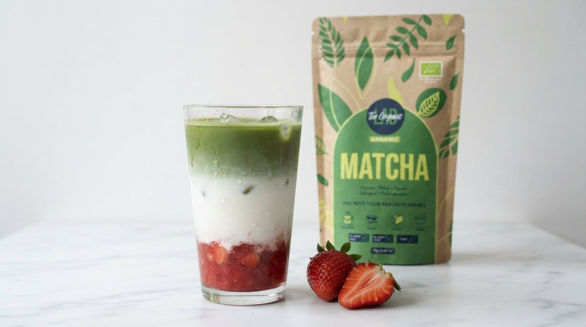 Iced strawberry matcha latte with fresh strawberries, milk and matcha powder.