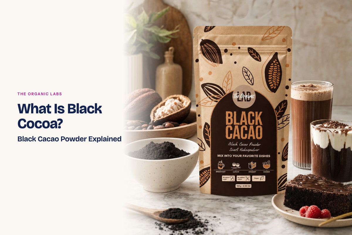 Black cocoa powder pack with a bowl of the powder, drinks and desserts