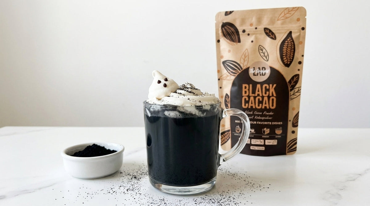 Black Cacao Halloween Hot Chocolate with whipped cream and meringue ghost made with Black Cacao Powder.
