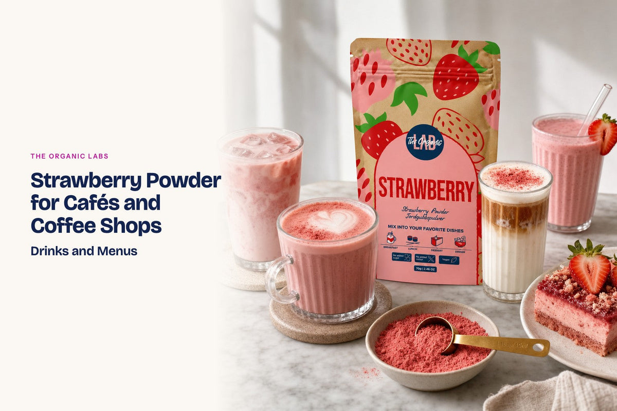 Freeze-dried strawberry powder pack with hot and iced lattes on a café counter