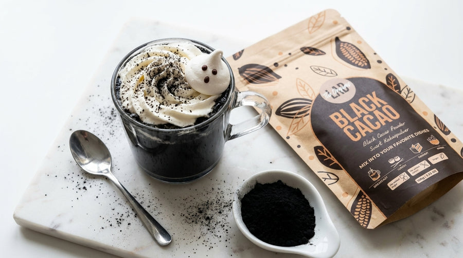 Black Cacao Halloween Hot Chocolate with whipped cream and meringue ghost made with Black Cacao Powder.