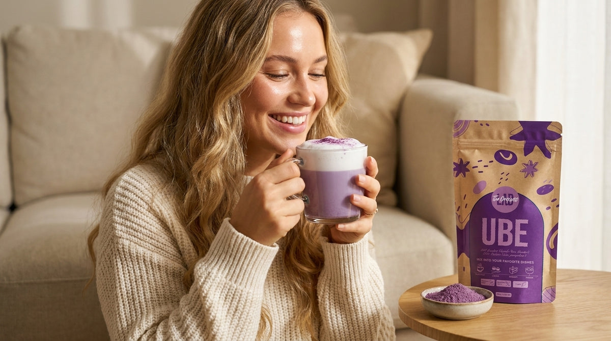 Woman enjoying an ube latte next to a pack of Ube Powder