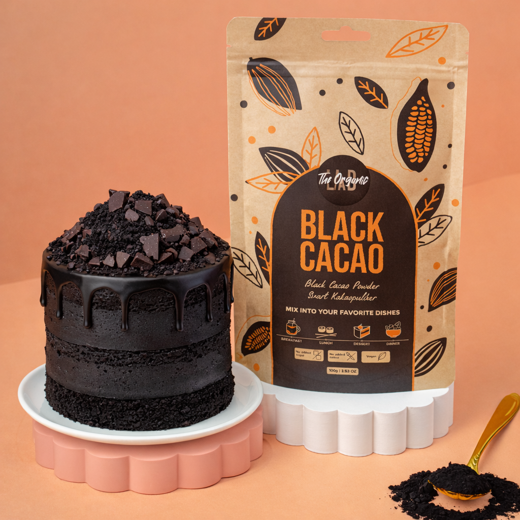 Black cacao layer cake with chocolate drip, baked with The Organic Lab Black Cacao Powder in a 100 g pouch