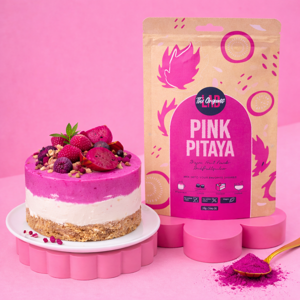 Pink pitaya cheesecake topped with fresh dragon fruit and berries