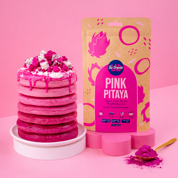 Stack of pink pancakes made with pink pitaya powder